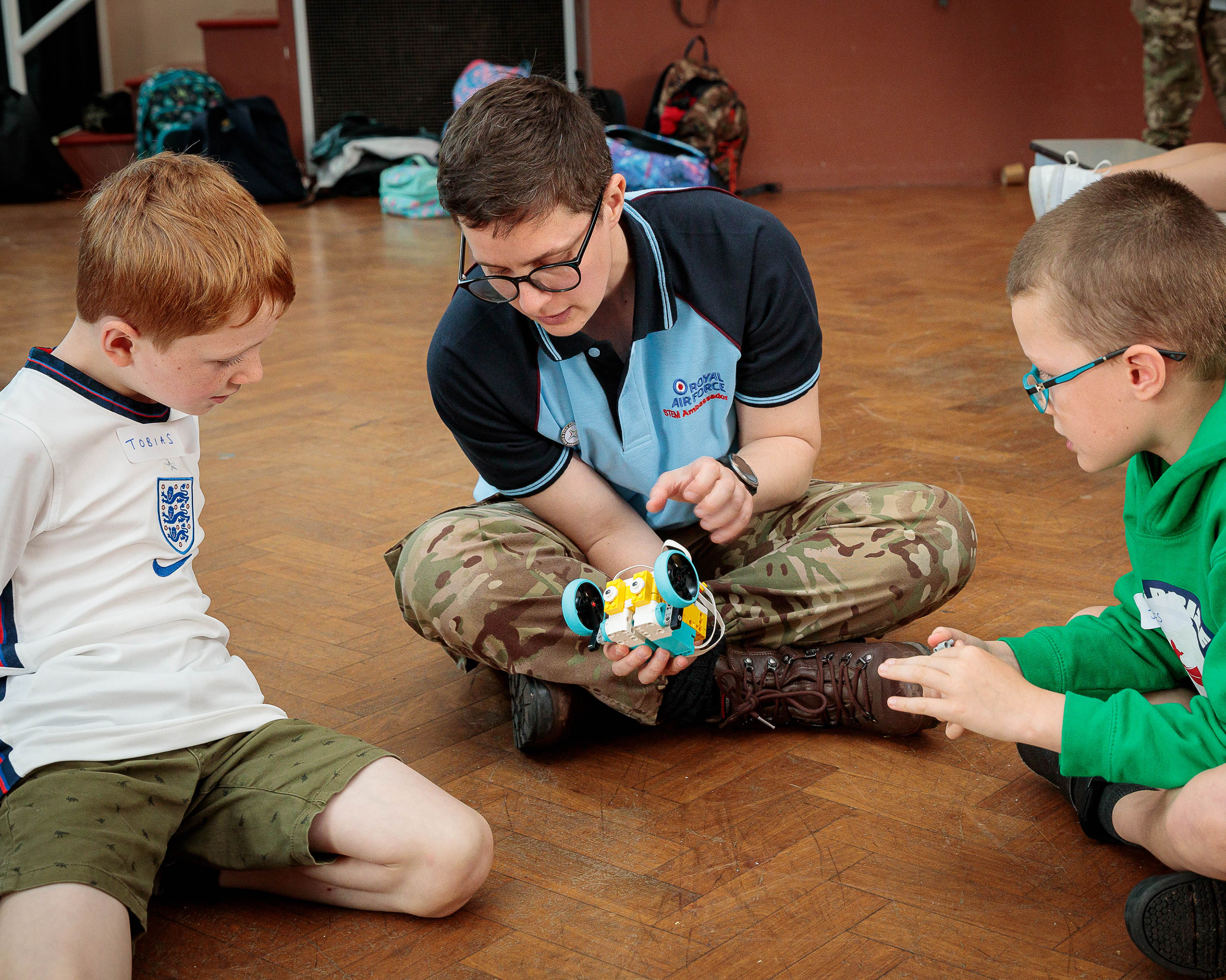 Children excitedly attempt a range of projects from Stixx, which uses paper in tube form to create structures, to LEGO Spike, which uses LEGO building elements and coding to create robots